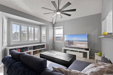Well lit living room with plantation shutters.