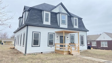 View of front facade featuring roof with shingles,