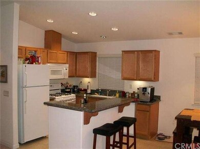 Kitchen with granite counters, island, newer appli
