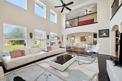This spacious, modern living area features high ce