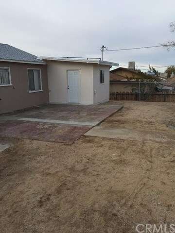 Fenced Back Yard with Patio Concrete Slab.