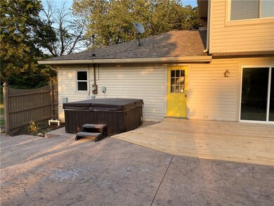 Hot tub off of laundry and mud room.