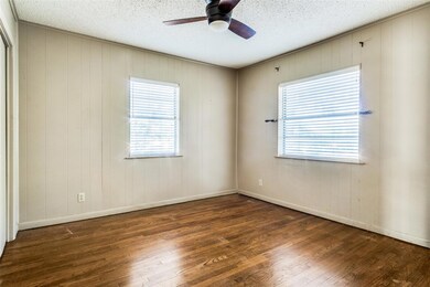 Spare room with ceiling fan, a healthy amount of s