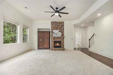 Unfurnished living room featuring visible vents, o