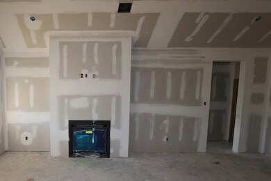 Cozy fireplace in great room - still under constru