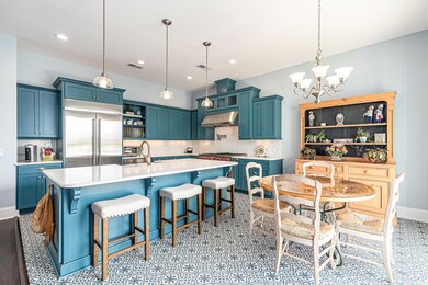 Kitchen with open shelves, built in refrigerator, 