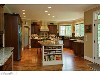 Kitchen. The gourmet kitchen is equipped with all you need to make a great meal.  This wonderfully large island is perfect for preparing food or grabbing a quick meal.