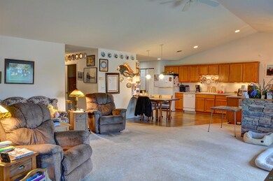 Living room featuring sink, vaulted ceiling, ceili