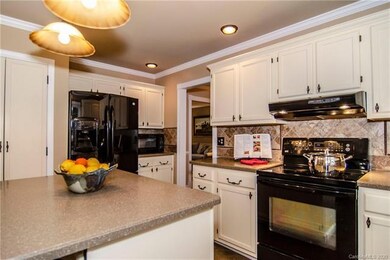 Plenty of room in this kitchen to visit while you 