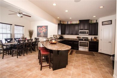 Open concept kitchen/dining area with lots of natu