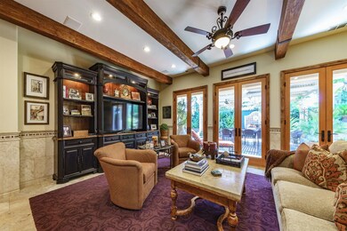Living room with several sets of french doors to t