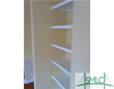 Living Room. Plenty of shelves for books and/or ac