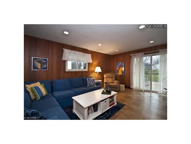 Family room with parquet floors and newer slider a
