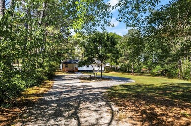 View of road featuring gravel driveway