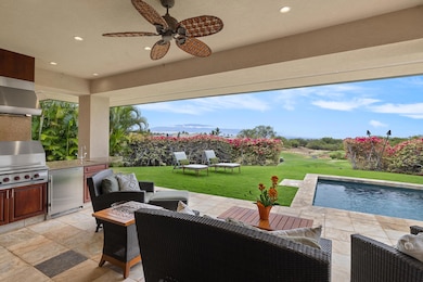 Covered lanai and outdoor gas grill.
