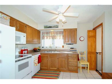 Kitchen. Pretty kitchen has oak cabinetry, updated