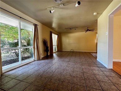 From the front door, the Living Room is to the rig