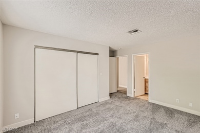 Unfurnished bedroom featuring carpet floors, a clo