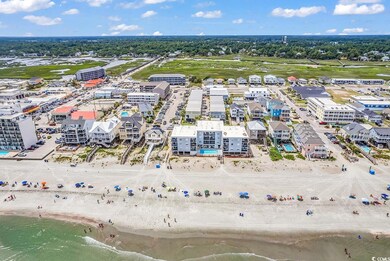 Bird's eye view featuring a water view and a beach