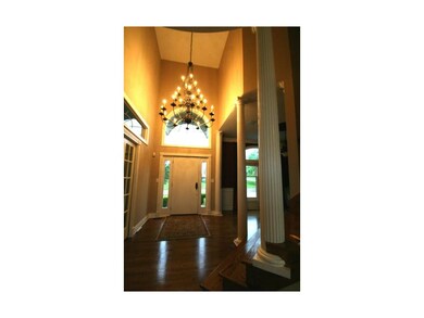 Luxurious Entry with large Chandelier in Entryway 