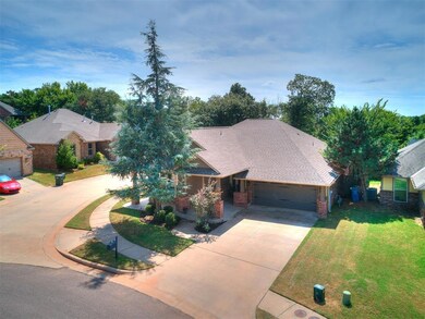 Ranch-style house with a garage and a front yard