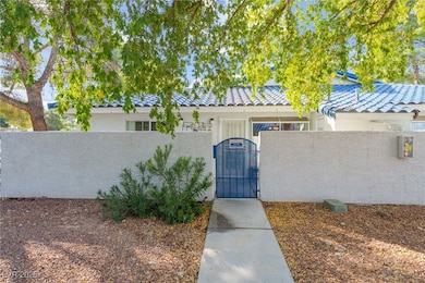 Doorway to property with a gate and stucco siding