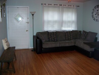 Hardwood floors and neutral paint makes this space