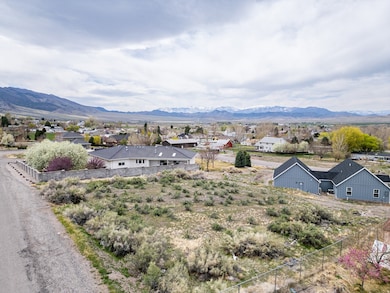 View of mountain backdrop with nearby rural area