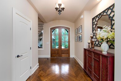 8-ft mahogany door welcomes you into the home.