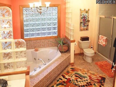 Ceramic tiled Master bath with jetted tub and walk