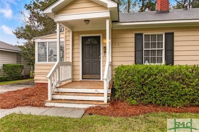 Covered front porch greets your guests as they app