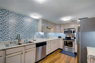 Freshly updated kitchen with stainless appliances,