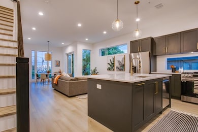 Kitchen featuring sink, hanging light fixtures, li