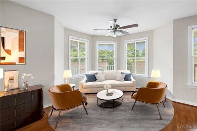 Living room with ceiling fan and wood-type flooring