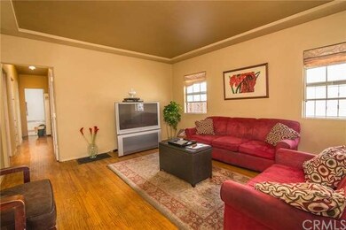 Spacious living room with hardwood flooring.