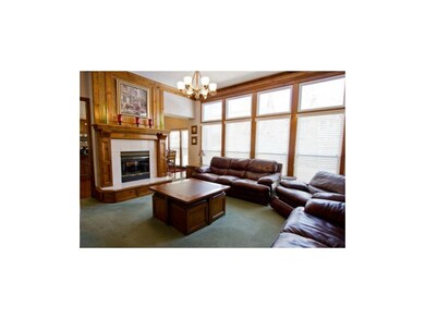 Large Living Room, with floor to Ceiling Windows.