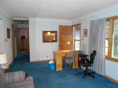 Living Room - Coved ceilings, hardwood floors unde