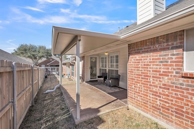 Single story home featuring a garage, driveway, br
