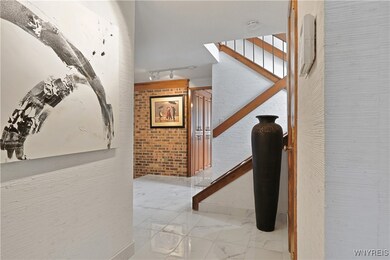 Front Entrance w/porcelain floors and bamboo wallp