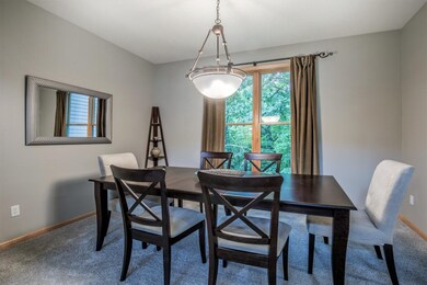 Formal dining room with serene mealtime views.