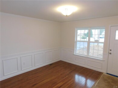Living Room with Oak Flooring, Picture Frame & Cro