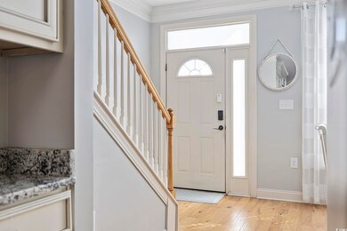 Foyer entrance featuring light hardwood / wood-sty