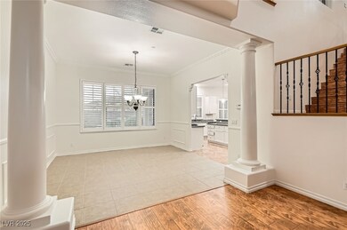 Unfurnished dining area featuring crown molding, v
