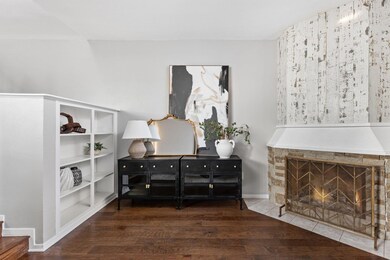 Detailed view of wood finished floors, a fireplac