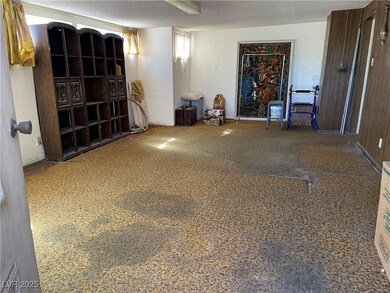 Unfurnished room with a textured ceiling