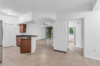 Kitchen featuring kitchen peninsula, sink, ceiling