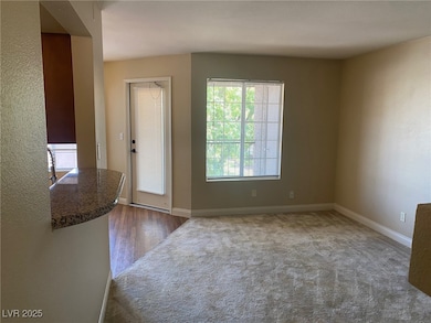 Featuring baseboards and dark wood-type flooring