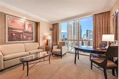 Living area with a view of skyline, crown molding,