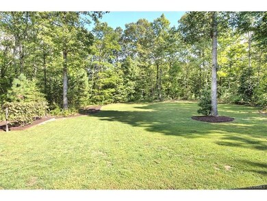 What an amazing FRONT yard surrounded by trees, be