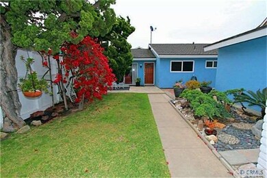 Front courtyard with blooming bushes.
